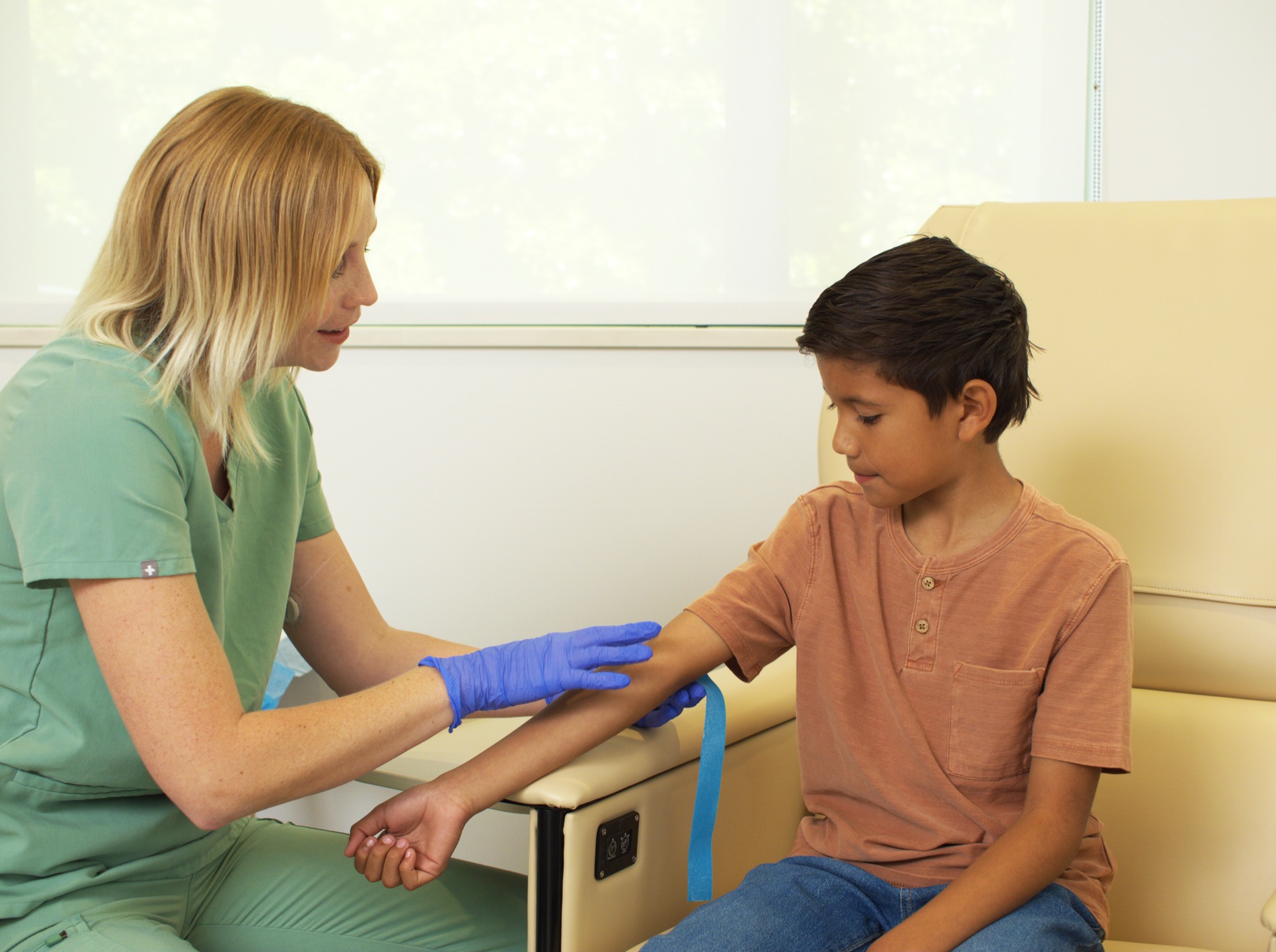 Family One Son and Doctor Ready to Draw Blood